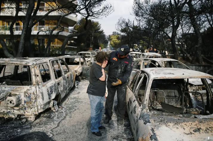 Figure 8: A Woman tries to find her dog in Mati. (Source https://www.insider.com/greece-wildfire-outside-athens-worst-since-2007-at-least-50-dead-2018-7)