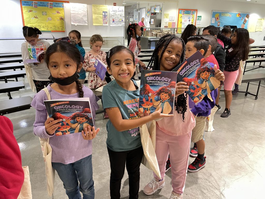 Figure 2a Students At The California Science Center Holding Their Oncology Book Photo By Dieuwertje Kast